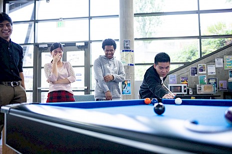 Students playing pool