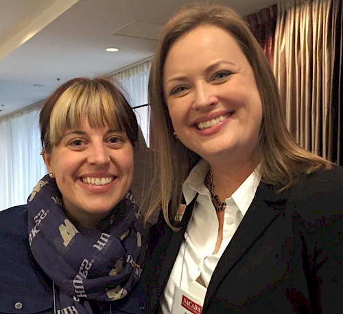 Julie and Nicole standing together for a photo