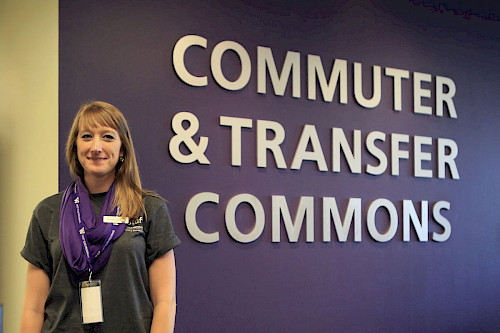 Program Manager Ali in front of Commuter and Transfer Commons Sign