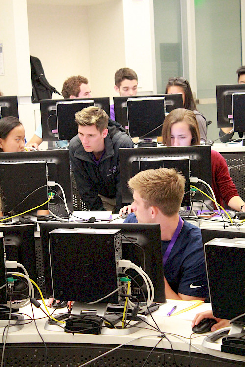 Jack helping students in a computer lab
