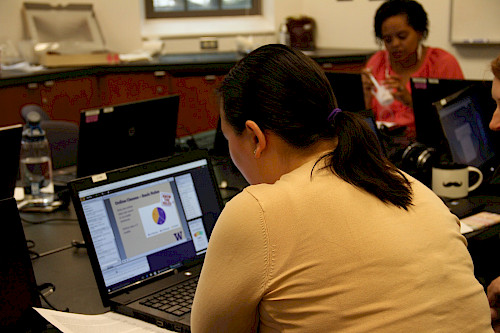 Person sitting in front of an open laptop