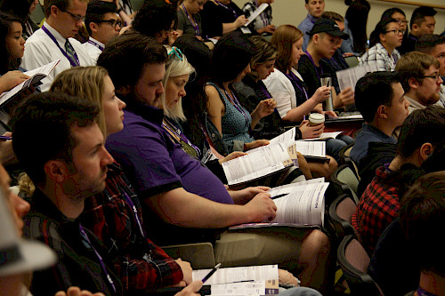 Transfer students sitting together reading a handout